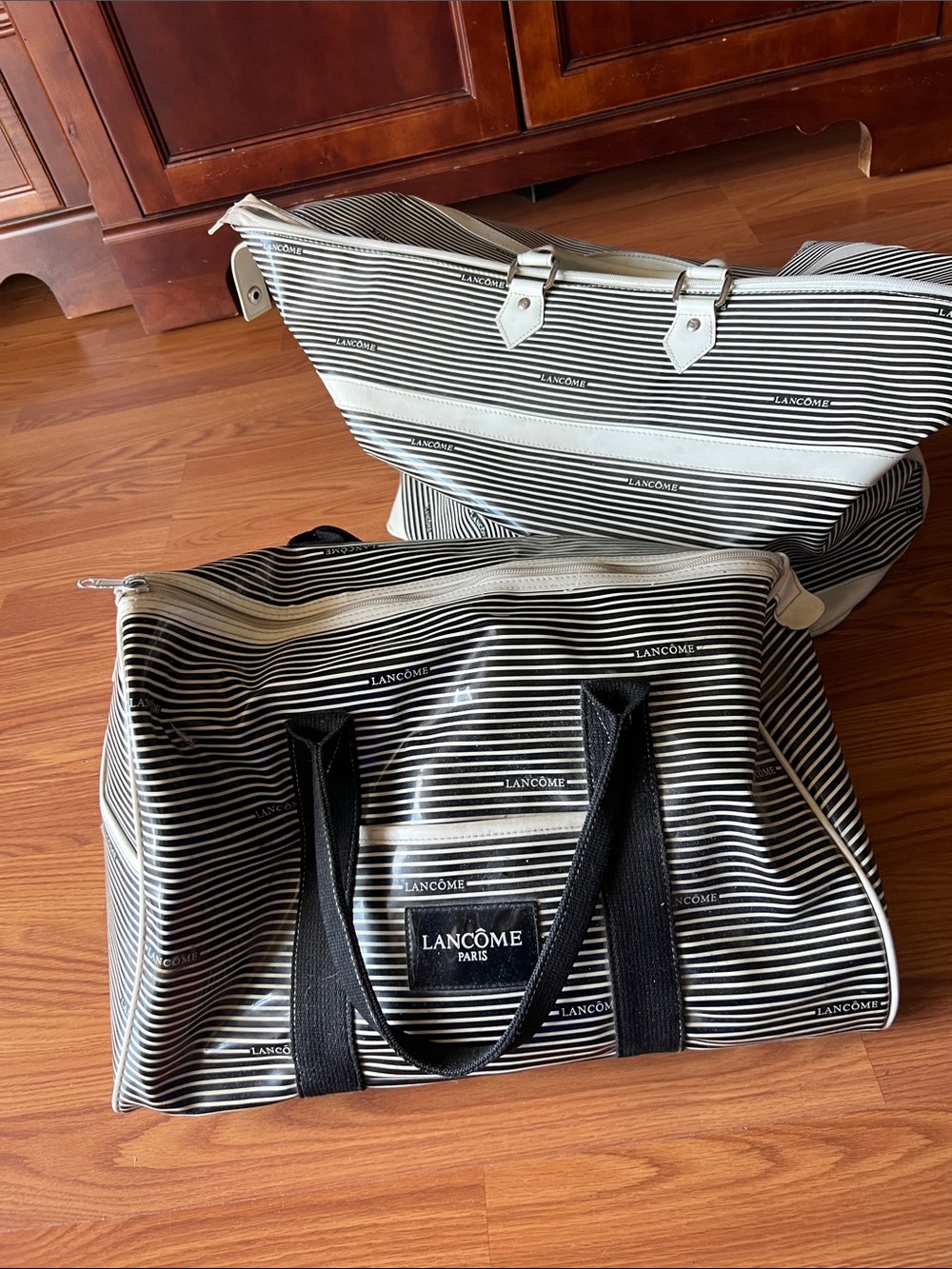 Bundle up two vintage Lancome weekend bags
